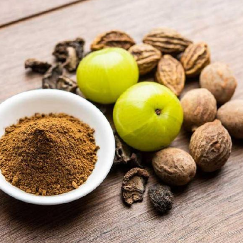 Herbs and Ayurvedic powder in a bowl